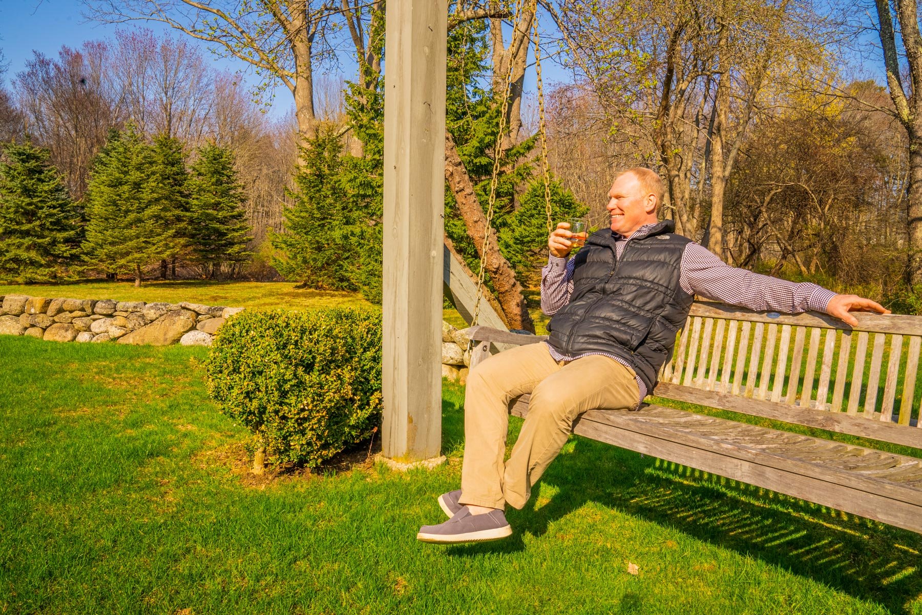 homeowner relaxing in his yard