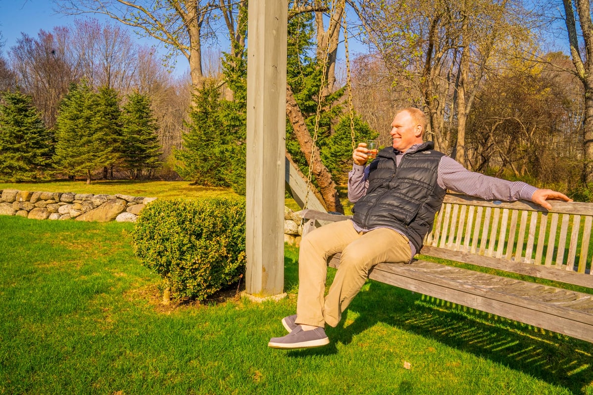 happy homeowner enjoying his yard