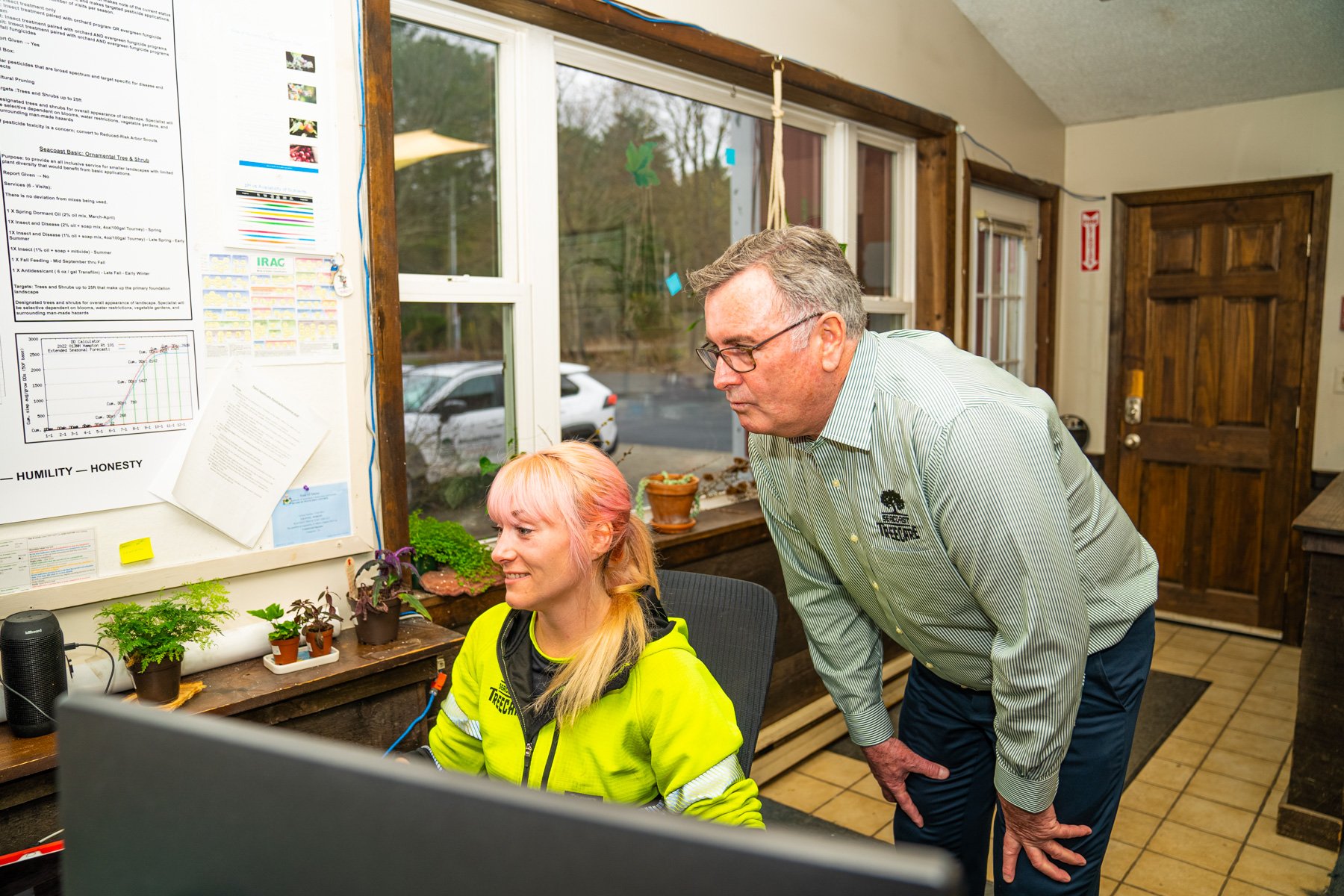 arborist reviewing project details with crew